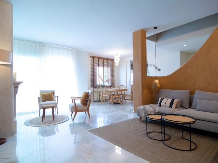 Versatile living room with two elegant sitting areas